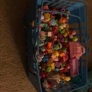 Shopkin toys and a shopkin grocery basket